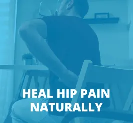 person holding their back and hip in pain