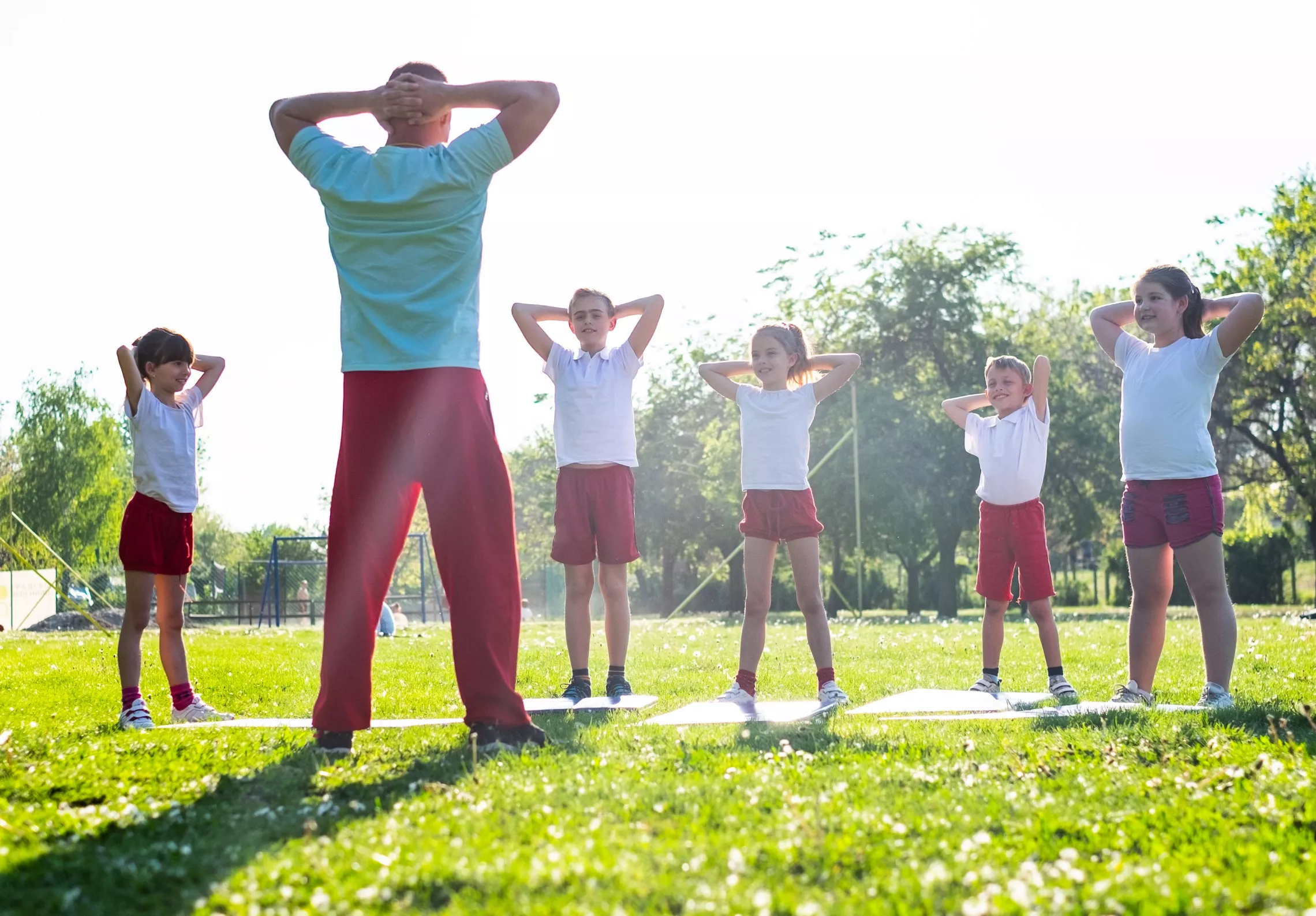 Youth group training 101. Kids exercising outdoors