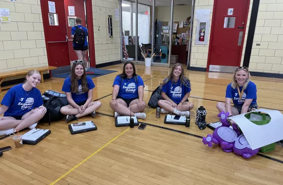 Five camp staff members getting ready for the day